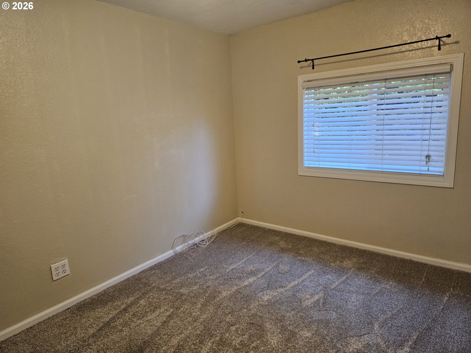 237 Wharf Street Brookings, OR 97415 - Photo 11 of 27 a view of an empty room with a window