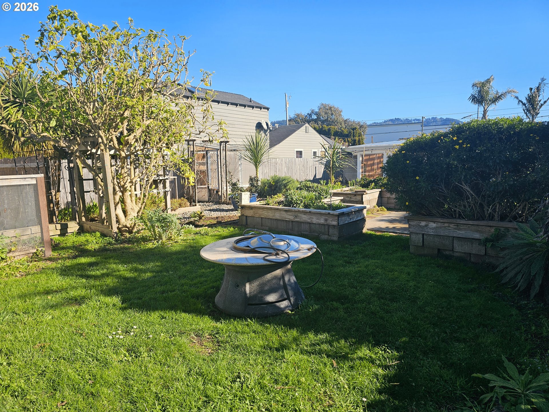 237 Wharf Street Brookings, OR 97415 - Photo 21 of 27 a garden view with a seating space