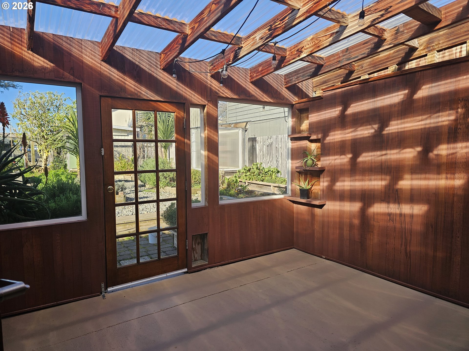 237 Wharf Street Brookings, OR 97415 - Photo 8 of 27 a bedroom with a bed and a window