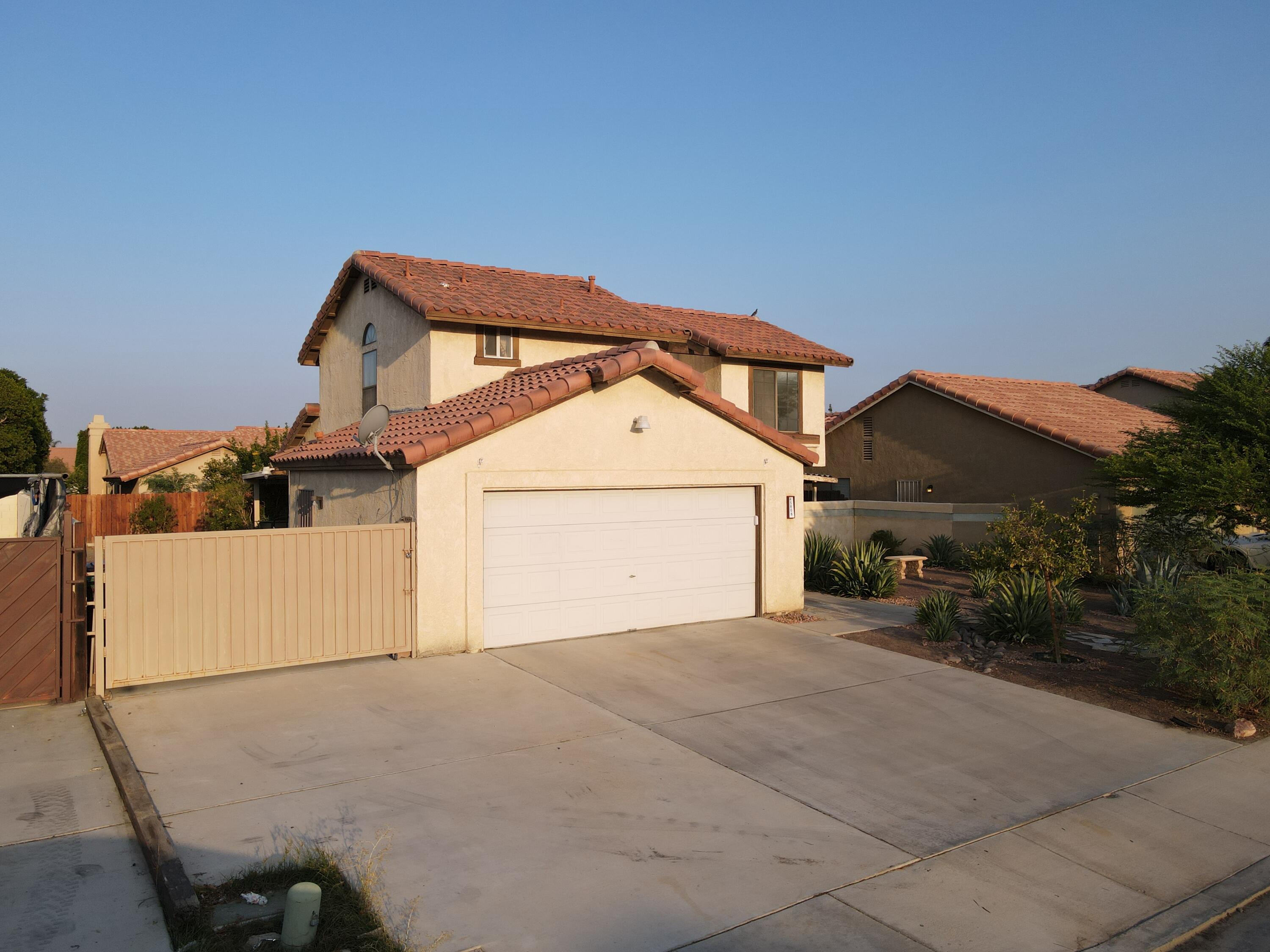 45808 Sutter Creek Road Indio, CA 92201 - Photo 2 of 55 a view of a house with a yard