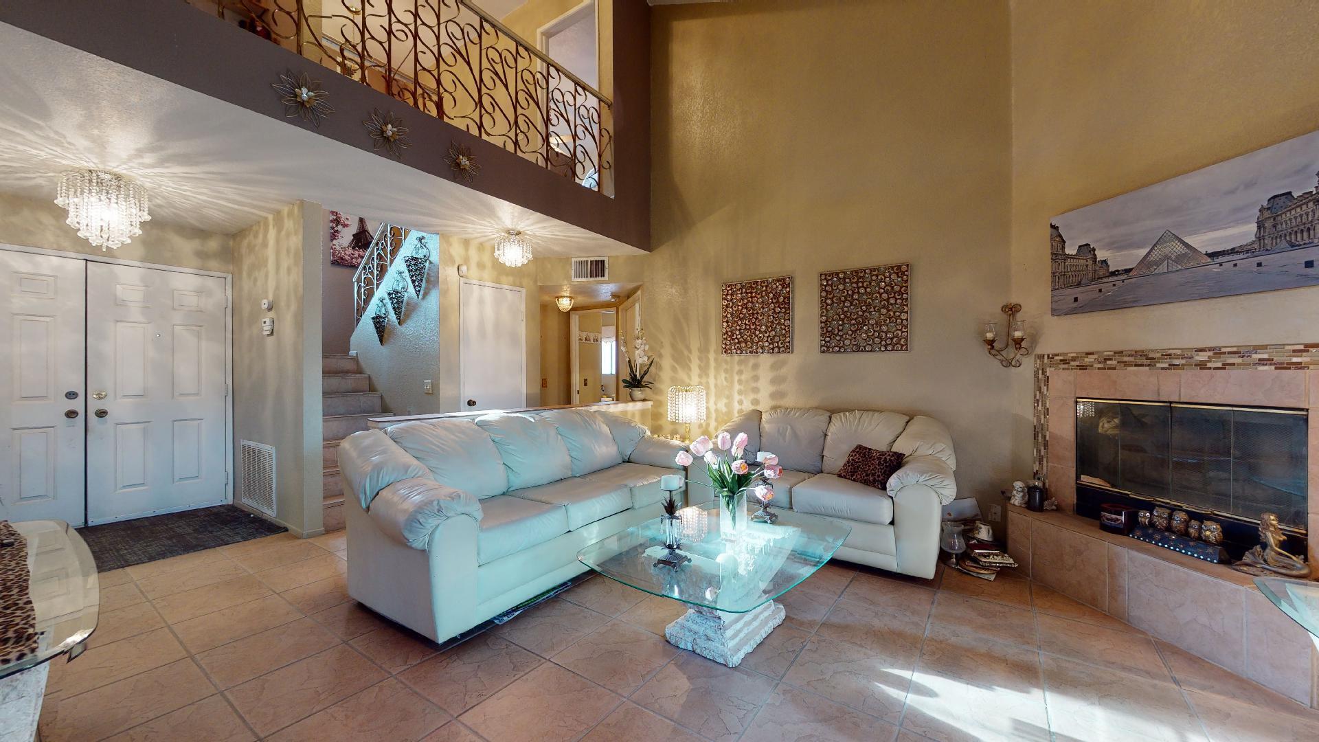 45808 Sutter Creek Road Indio, CA 92201 - Photo 13 of 55 a living room with furniture a fireplace and a flat screen tv
