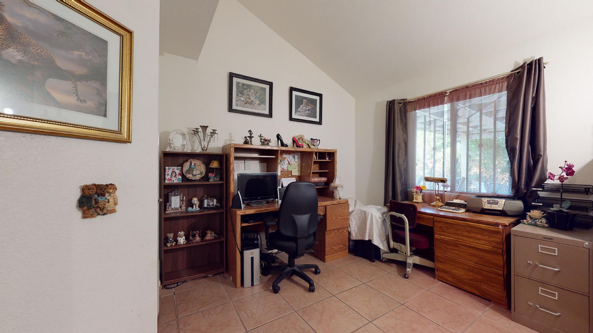 45808 Sutter Creek Road Indio, CA 92201 - Photo 16 of 55 a view of a workspace with furniture and a window