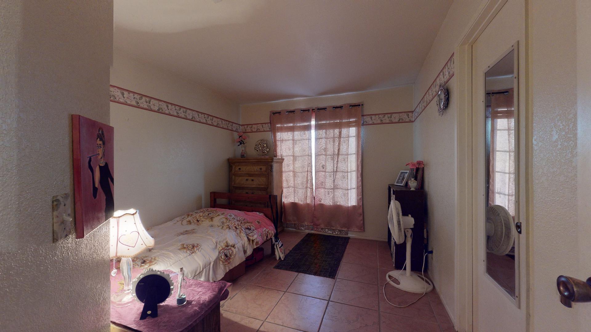 45808 Sutter Creek Road Indio, CA 92201 - Photo 28 of 55 a bedroom with a bed and a window
