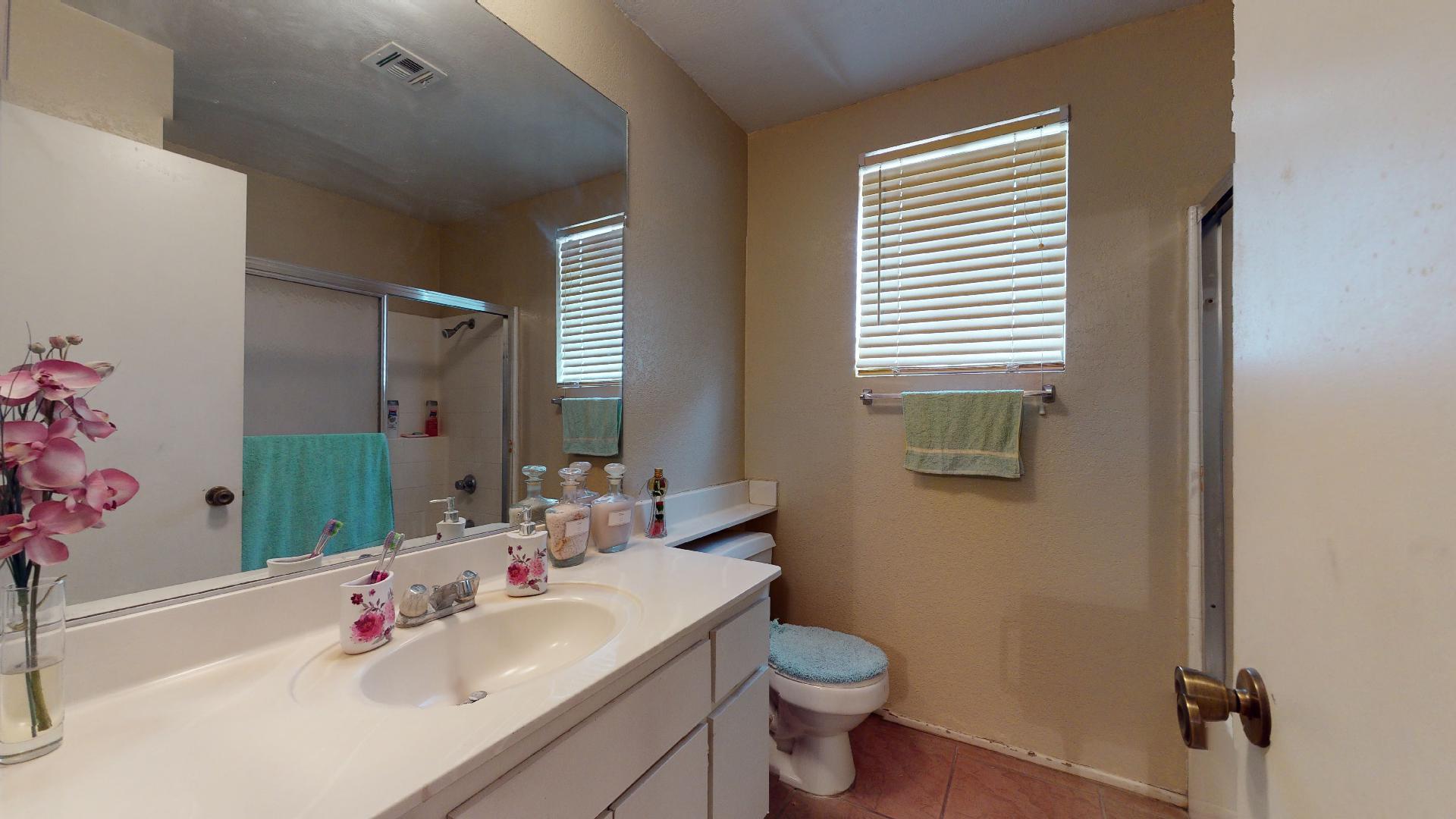 45808 Sutter Creek Road Indio, CA 92201 - Photo 30 of 55 a bathroom with a sink toilet and a mirror