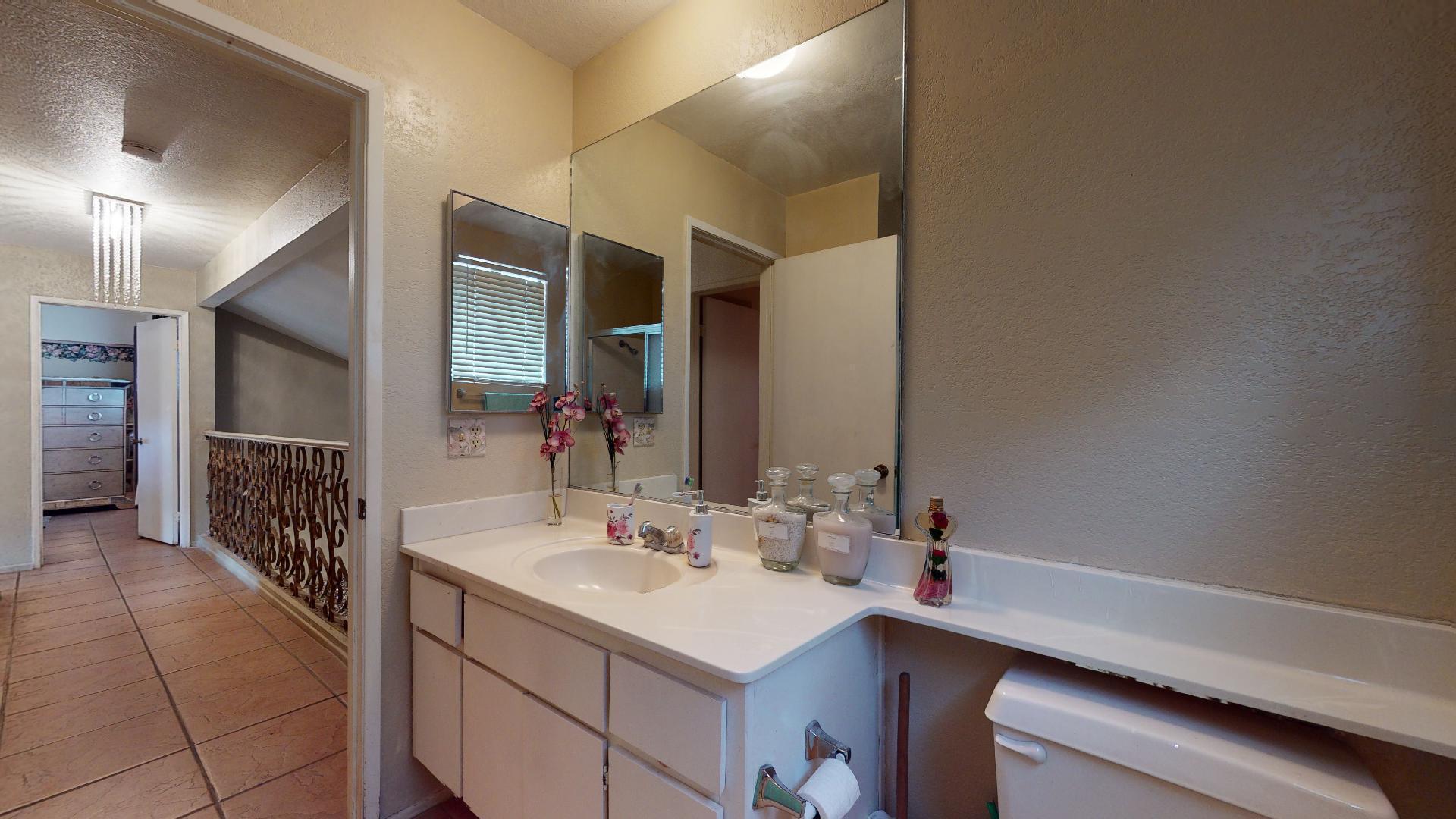 45808 Sutter Creek Road Indio, CA 92201 - Photo 31 of 55 a bathroom with a sink and a mirror