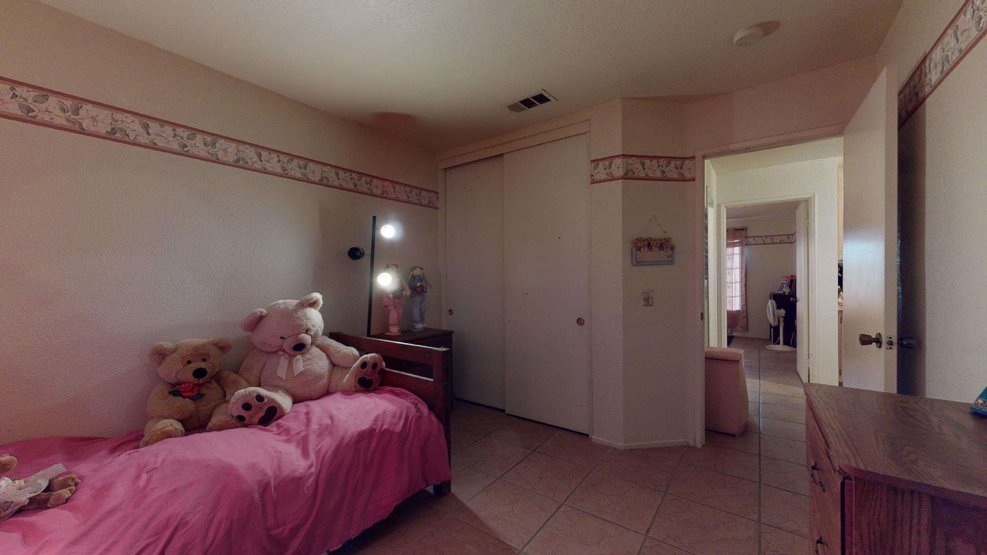 45808 Sutter Creek Road Indio, CA 92201 - Photo 33 of 55 a bed room with a bed and a lamp