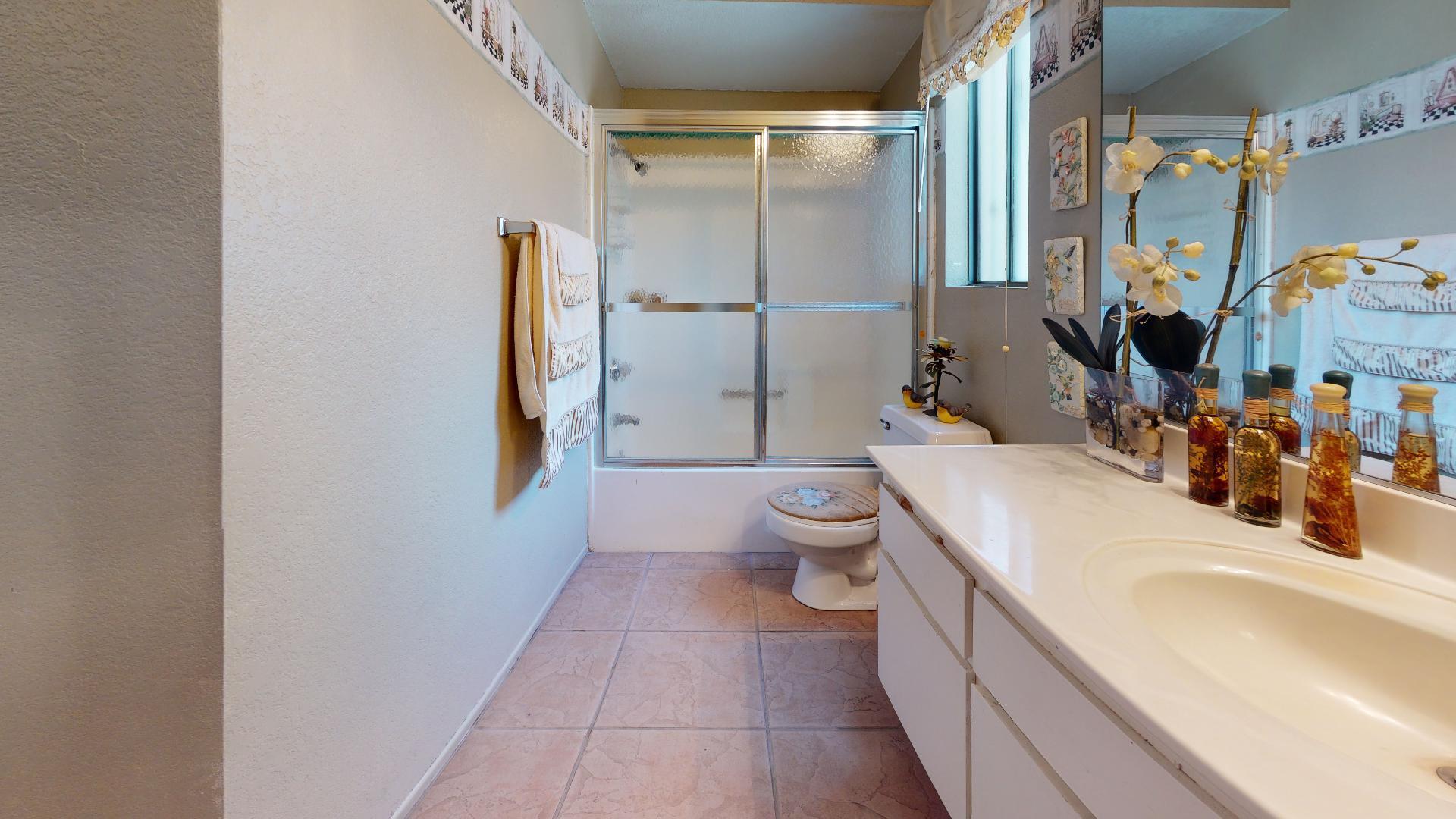 45808 Sutter Creek Road Indio, CA 92201 - Photo 35 of 55 a bathroom with a sink a toilet and shower