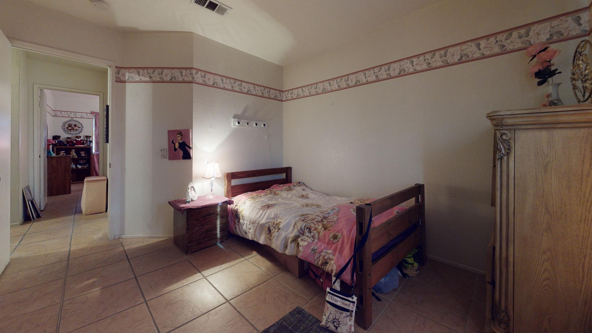 45808 Sutter Creek Road Indio, CA 92201 - Photo 40 of 55 a bed room with a bed and a table chair