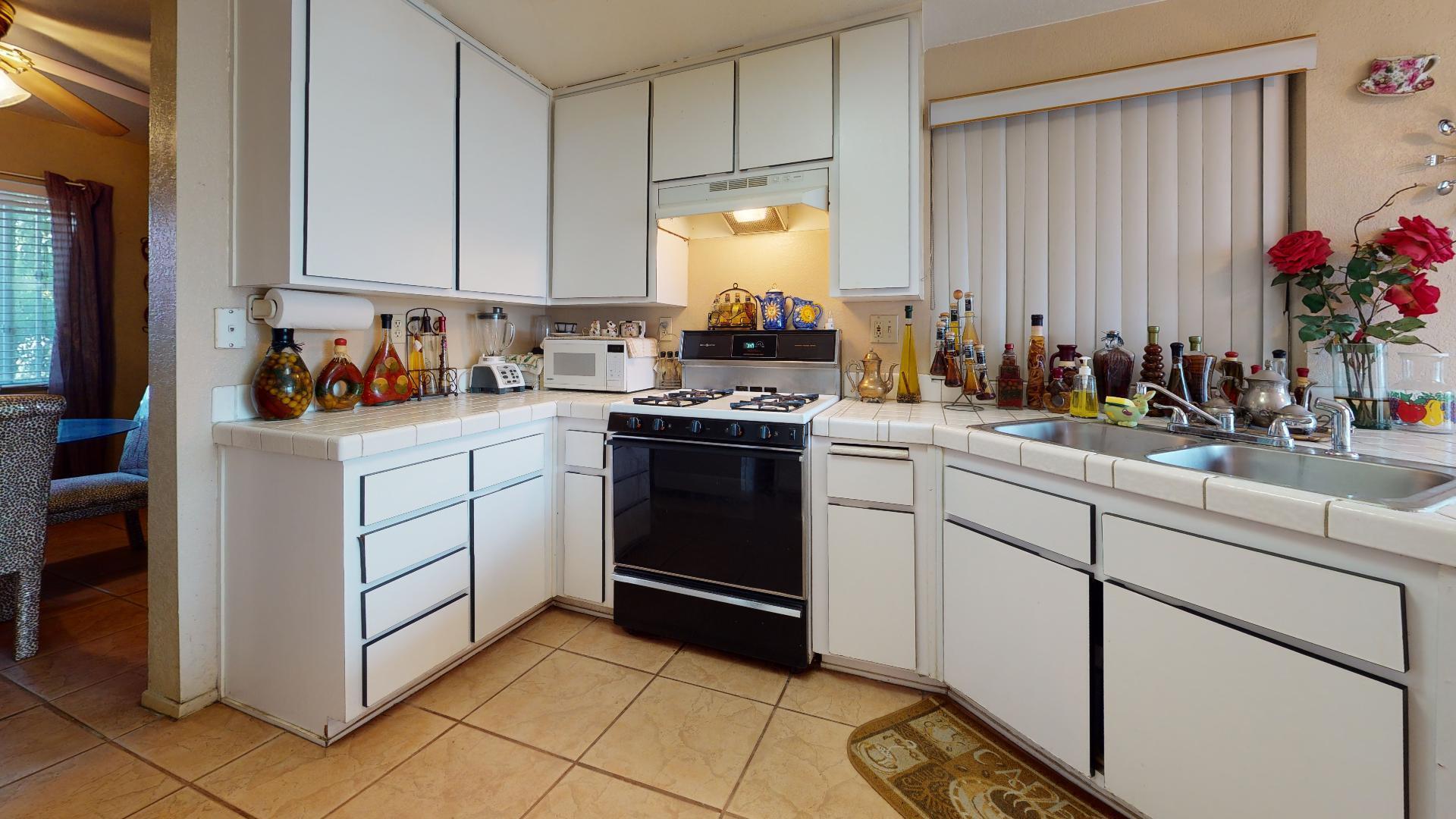 45808 Sutter Creek Road Indio, CA 92201 - Photo 43 of 55 a kitchen with a sink cabinets and appliances