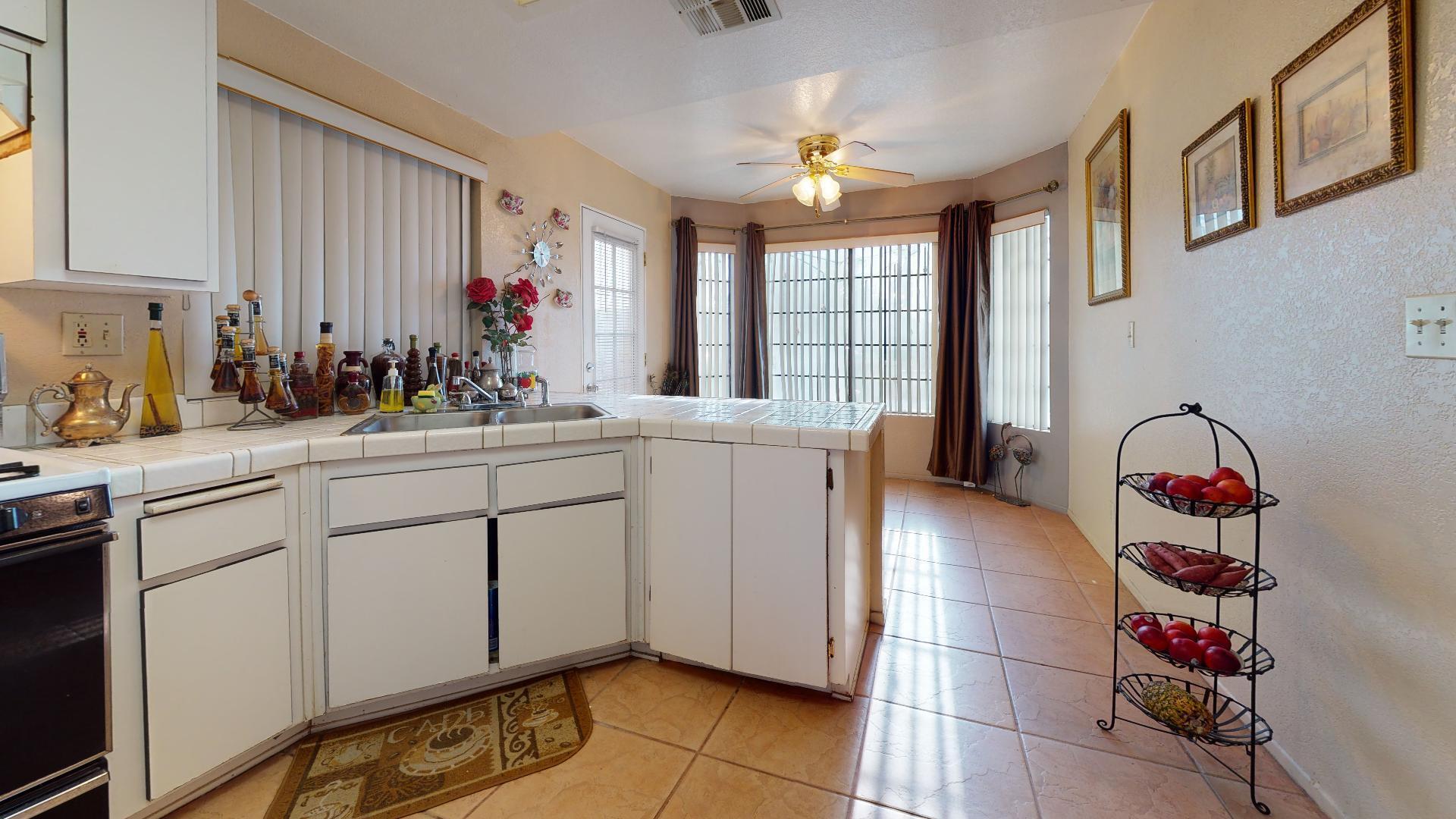 45808 Sutter Creek Road Indio, CA 92201 - Photo 44 of 55 a kitchen with a sink and cabinets