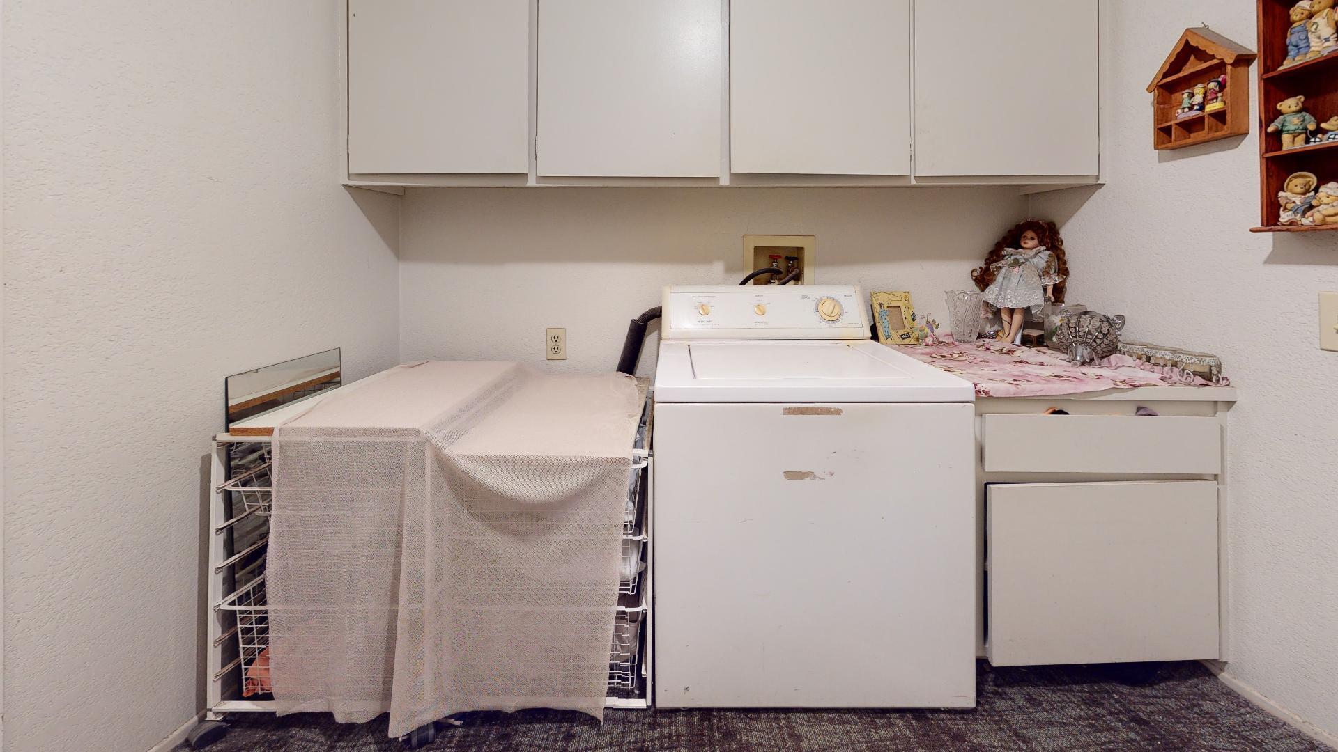 45808 Sutter Creek Road Indio, CA 92201 - Photo 45 of 55 a utility room with dryer and washer