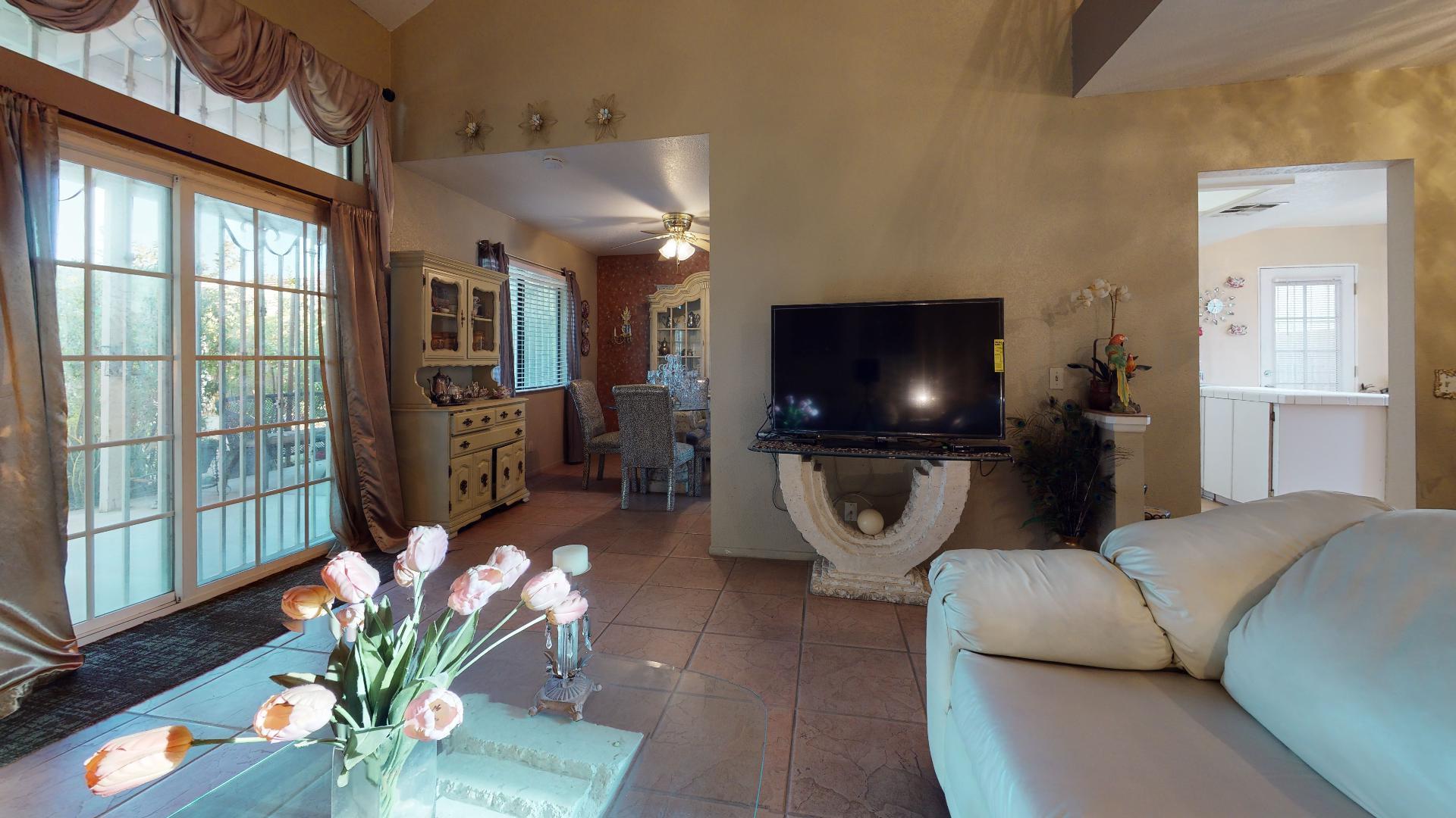 45808 Sutter Creek Road Indio, CA 92201 - Photo 46 of 55 a living room with furniture and a flat screen tv