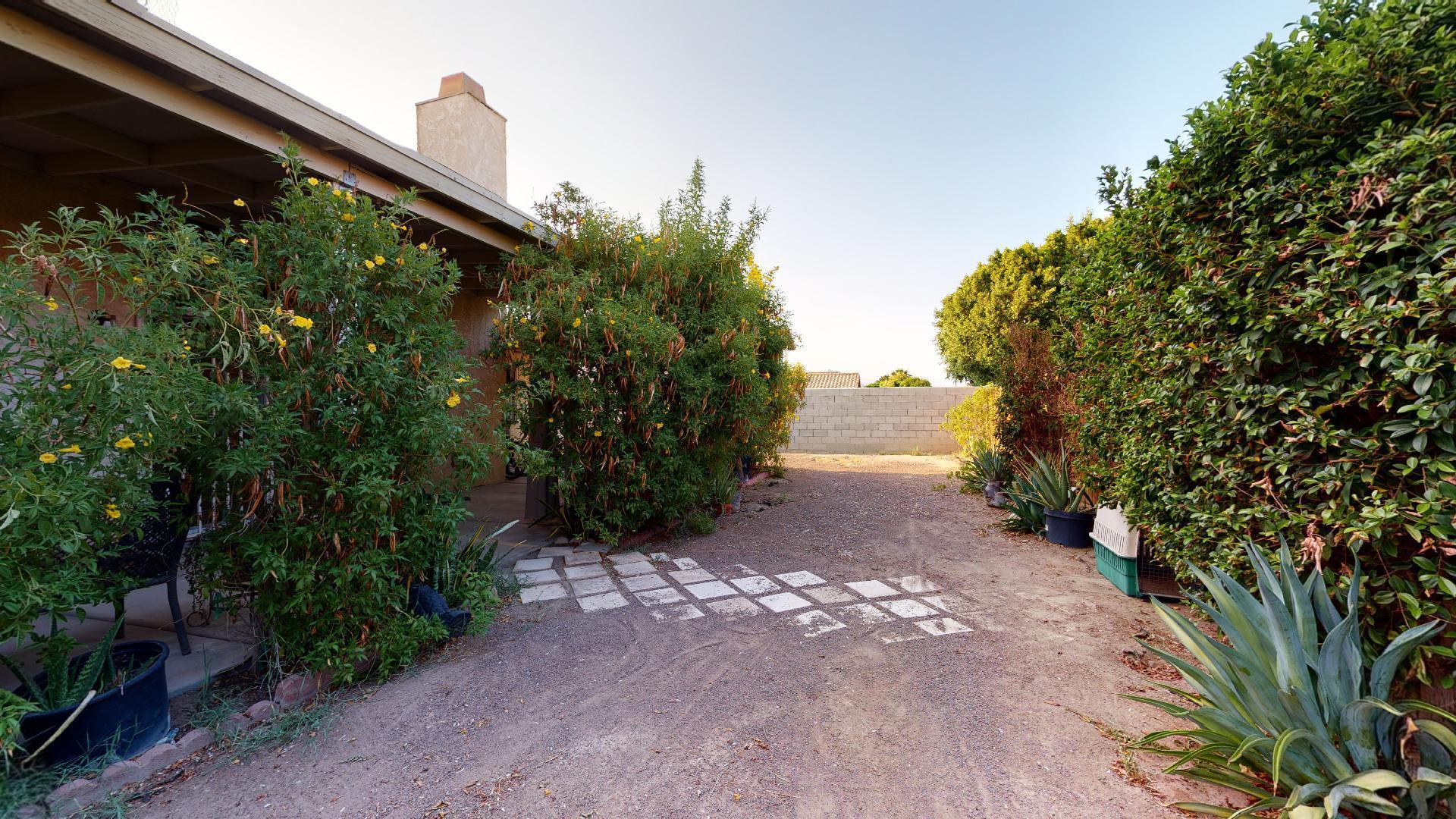 45808 Sutter Creek Road Indio, CA 92201 - Photo 50 of 55 a backyard of a house with lots of green space