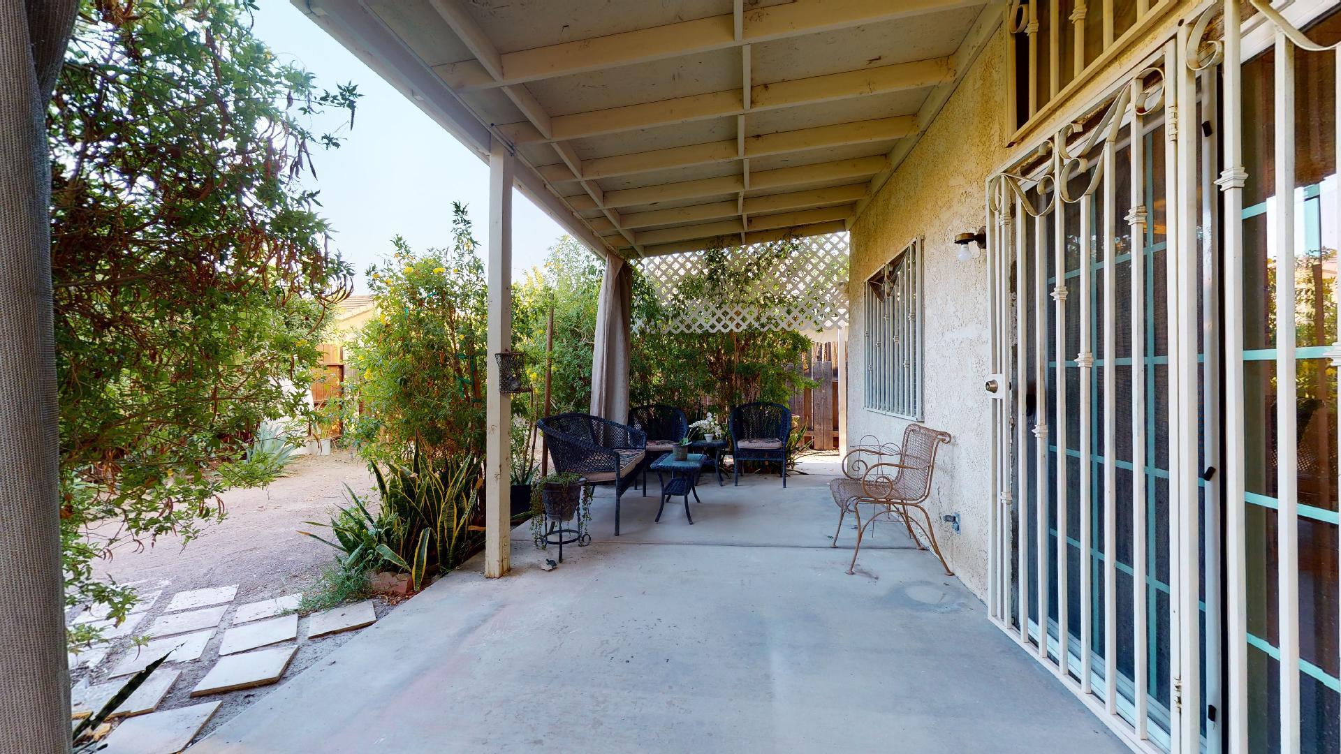 45808 Sutter Creek Road Indio, CA 92201 - Photo 53 of 55 a view of a porch with chairs and backyard