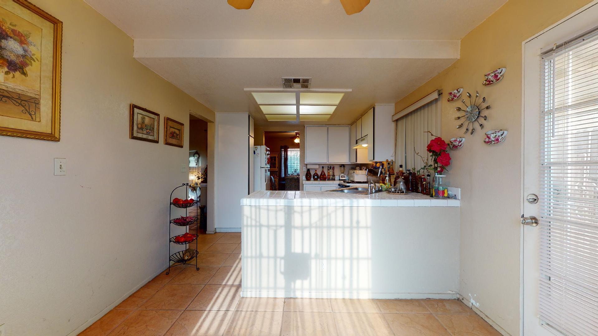 45808 Sutter Creek Road Indio, CA 92201 - Photo 7 of 55 a view of a room that has a window and a wooden floor