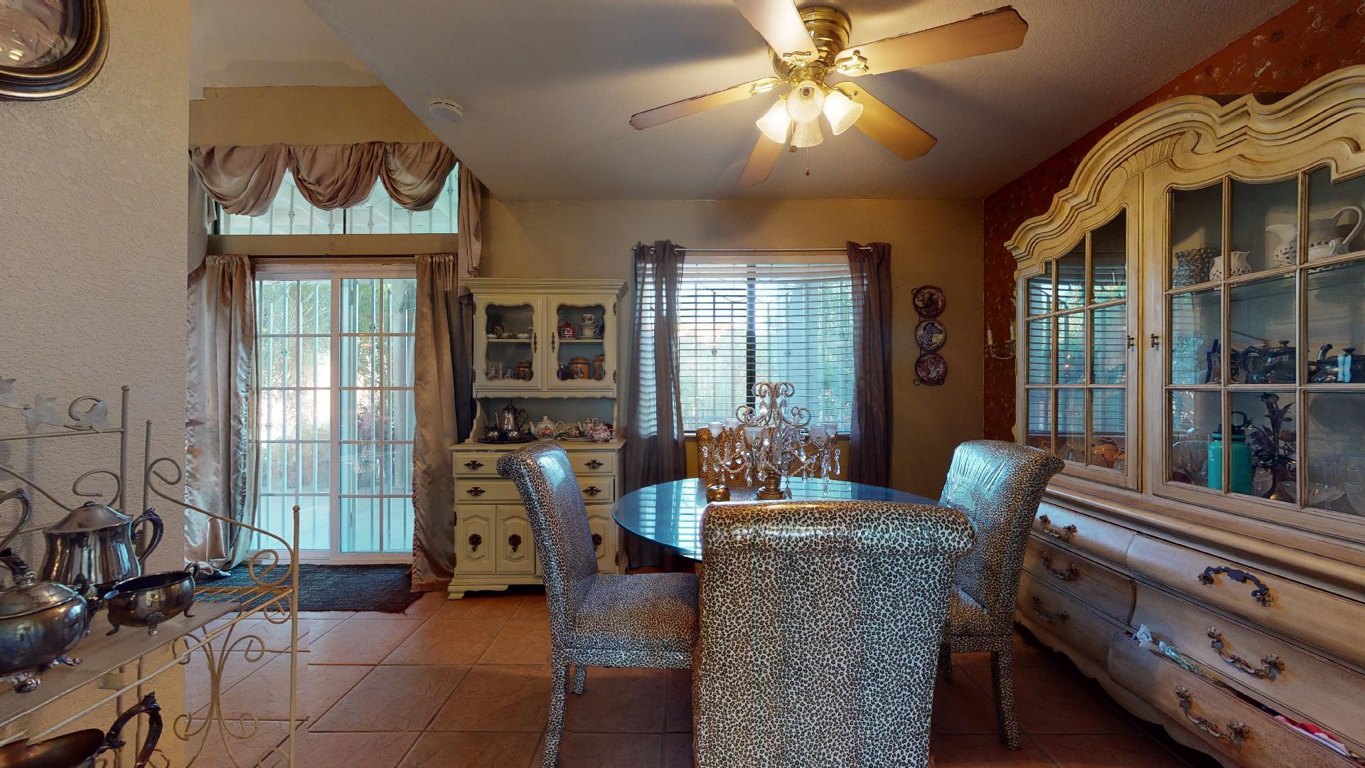 45808 Sutter Creek Road Indio, CA 92201 - Photo 10 of 55 a living room with furniture and a floor to ceiling window