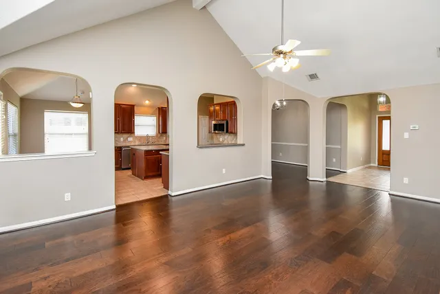 a view of an entryway with wooden floor