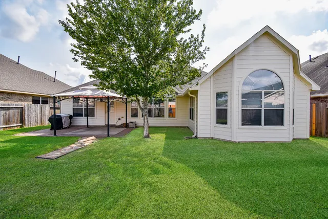 a front view of a house with a garden and porch