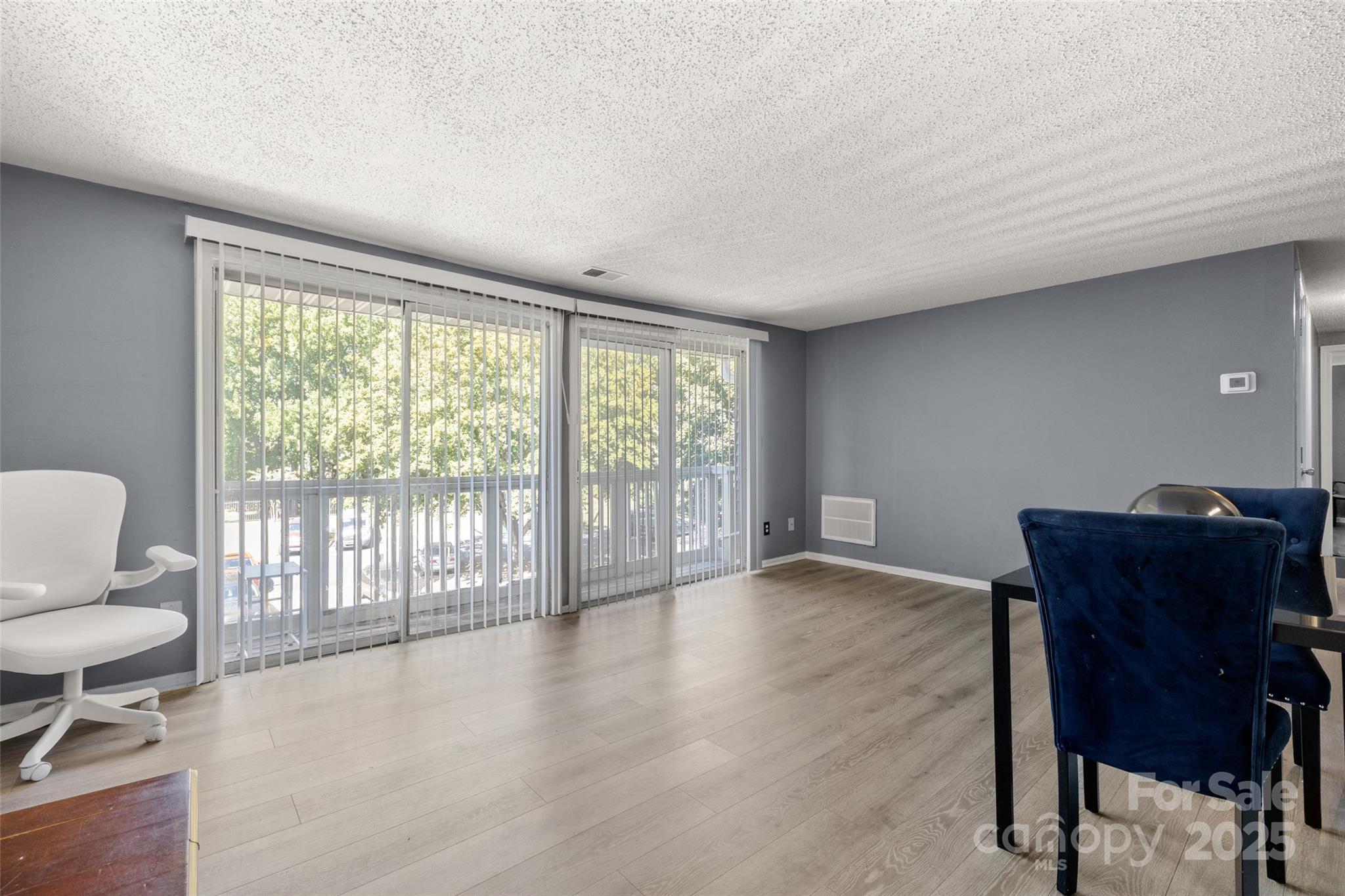 1634 Arlyn Circle, Unit J Charlotte, NC 28213 - Photo 6 of 13 a workspace room with furniture and a window