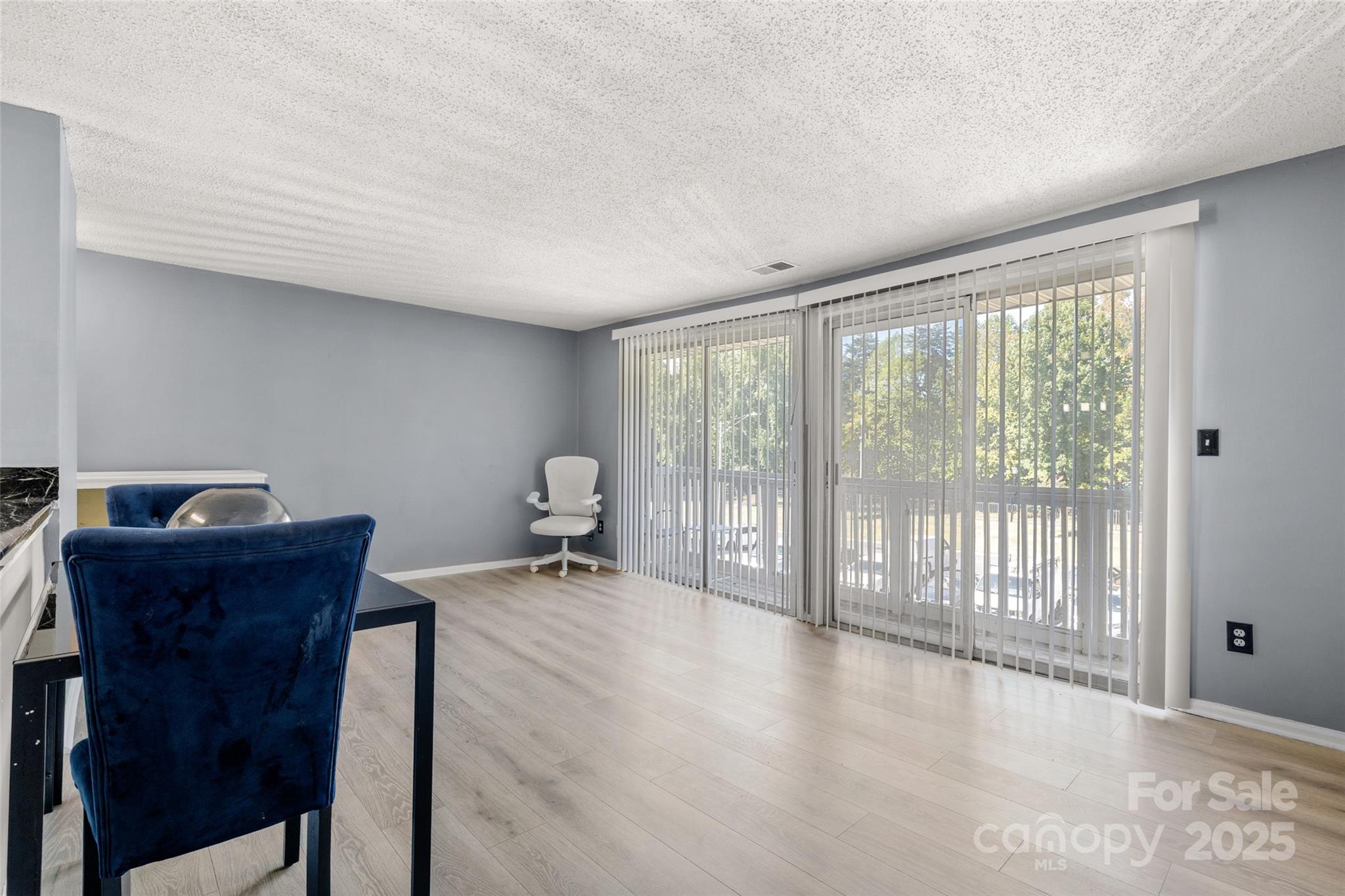 1634 Arlyn Circle, Unit J Charlotte, NC 28213 - Photo 7 of 13 a view of a workspace with furniture and a window