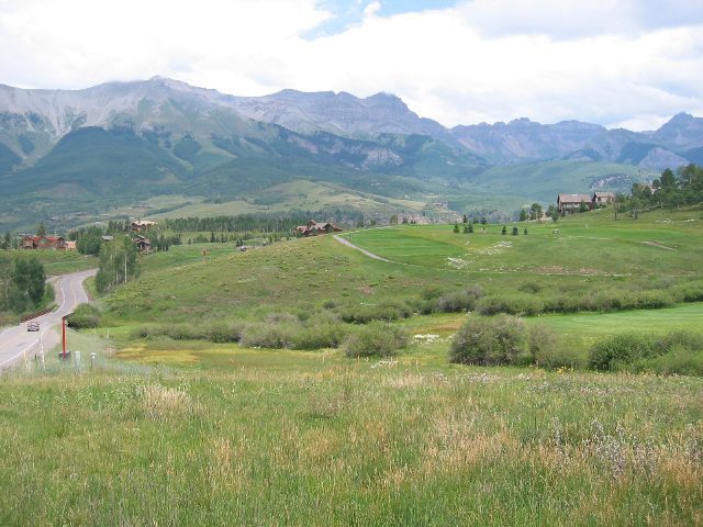 152 Adams Ranch Road Mountain Village, CO 81435 - Photo 1 of 5 a view of a lush green hillside and houses
