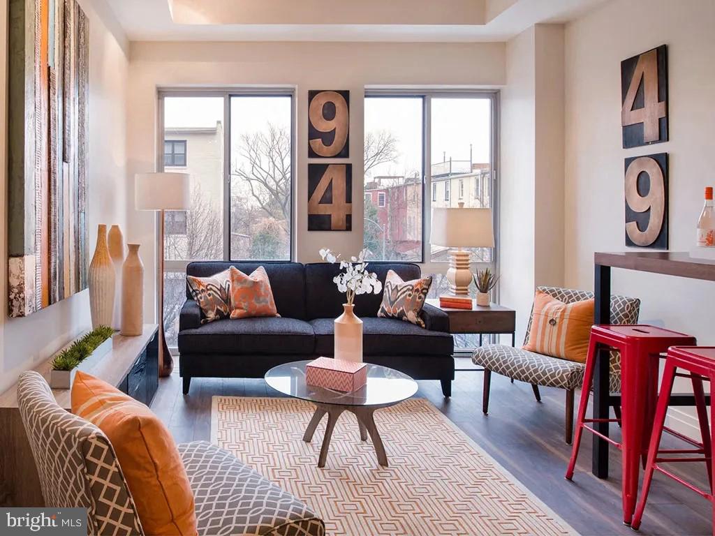 1350 R Street Northwest, Unit ONE BEDROOM SM Washington, DC 20009 - Photo 6 of 6 a living room with furniture and a large window