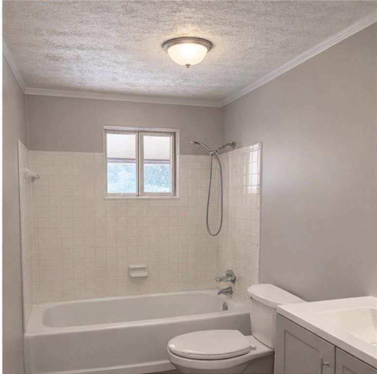 846 Wilson Circle Southwest Marietta, GA 30064 - Photo 4 of 6 a bathroom with a toilet sink vanity tub and shower