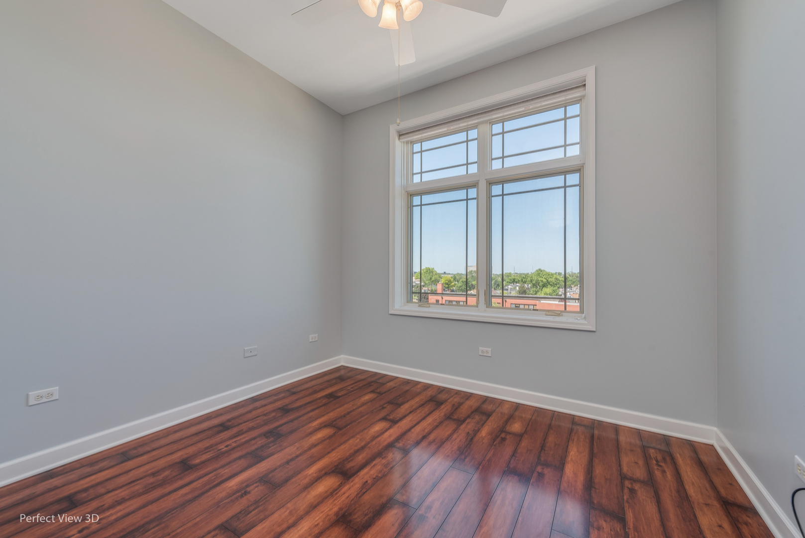77 North Wolf Road, Unit 601 Northlake, IL 60164 - Photo 13 of 19 a view of an empty room with wooden floor and a window