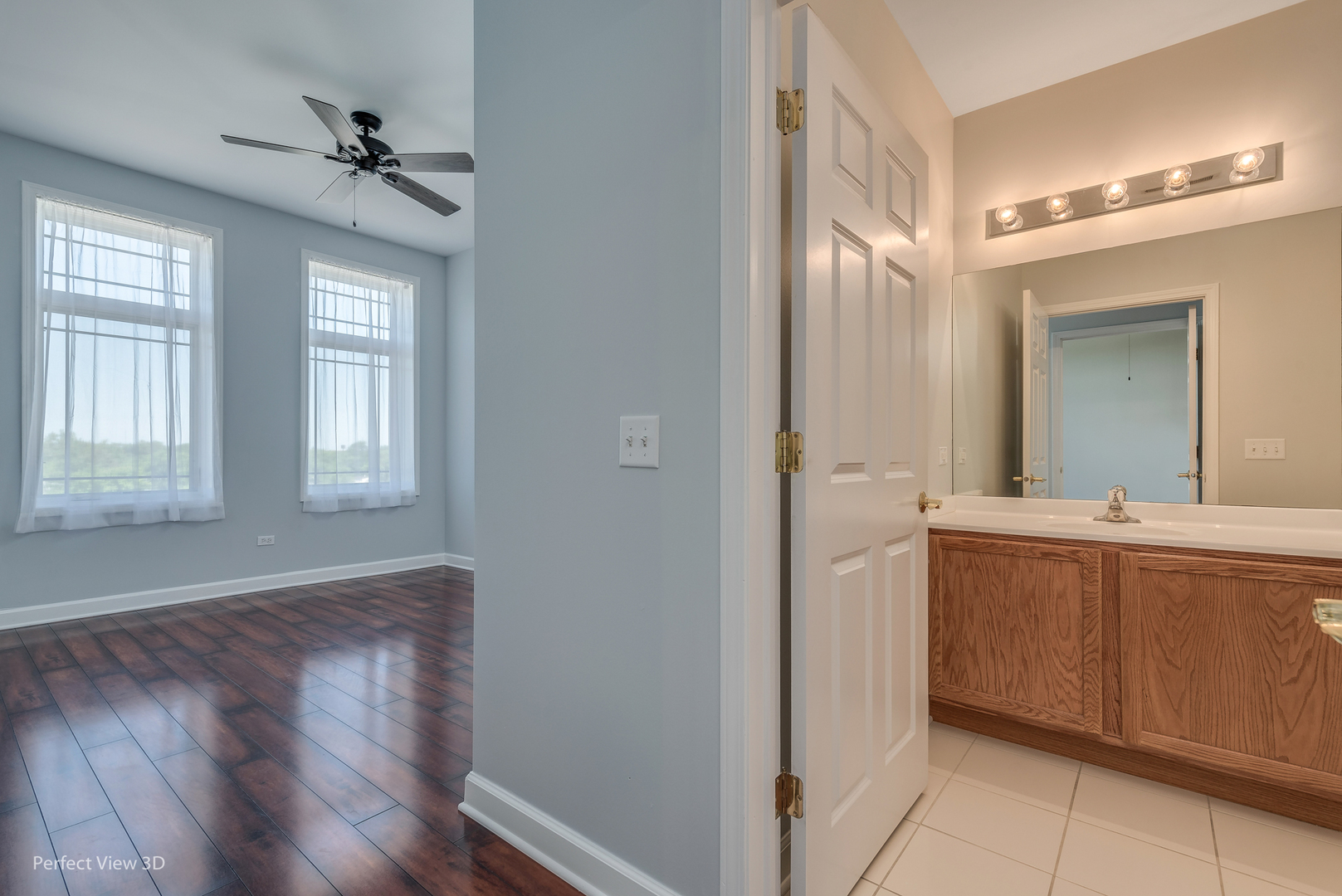 77 North Wolf Road, Unit 601 Northlake, IL 60164 - Photo 15 of 19 a view of a hallway with wooden floor and a bathroom