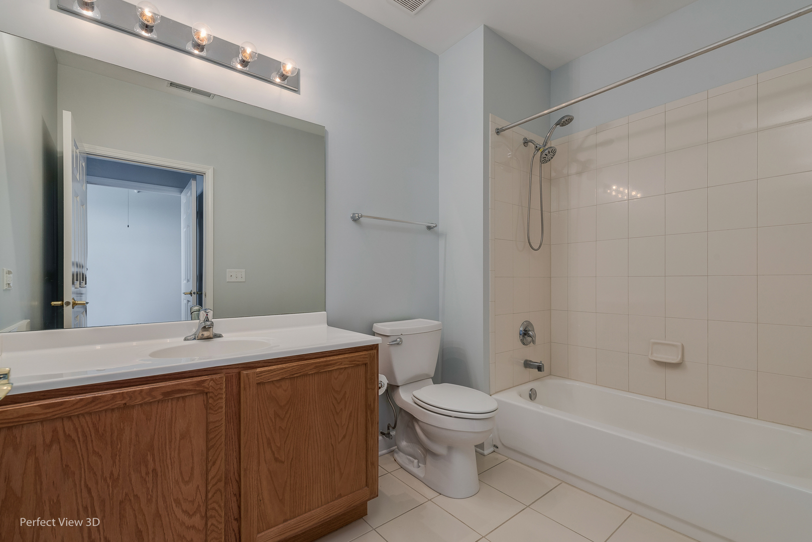 77 North Wolf Road, Unit 601 Northlake, IL 60164 - Photo 16 of 19 a bathroom with a sink toilet vanity and shower