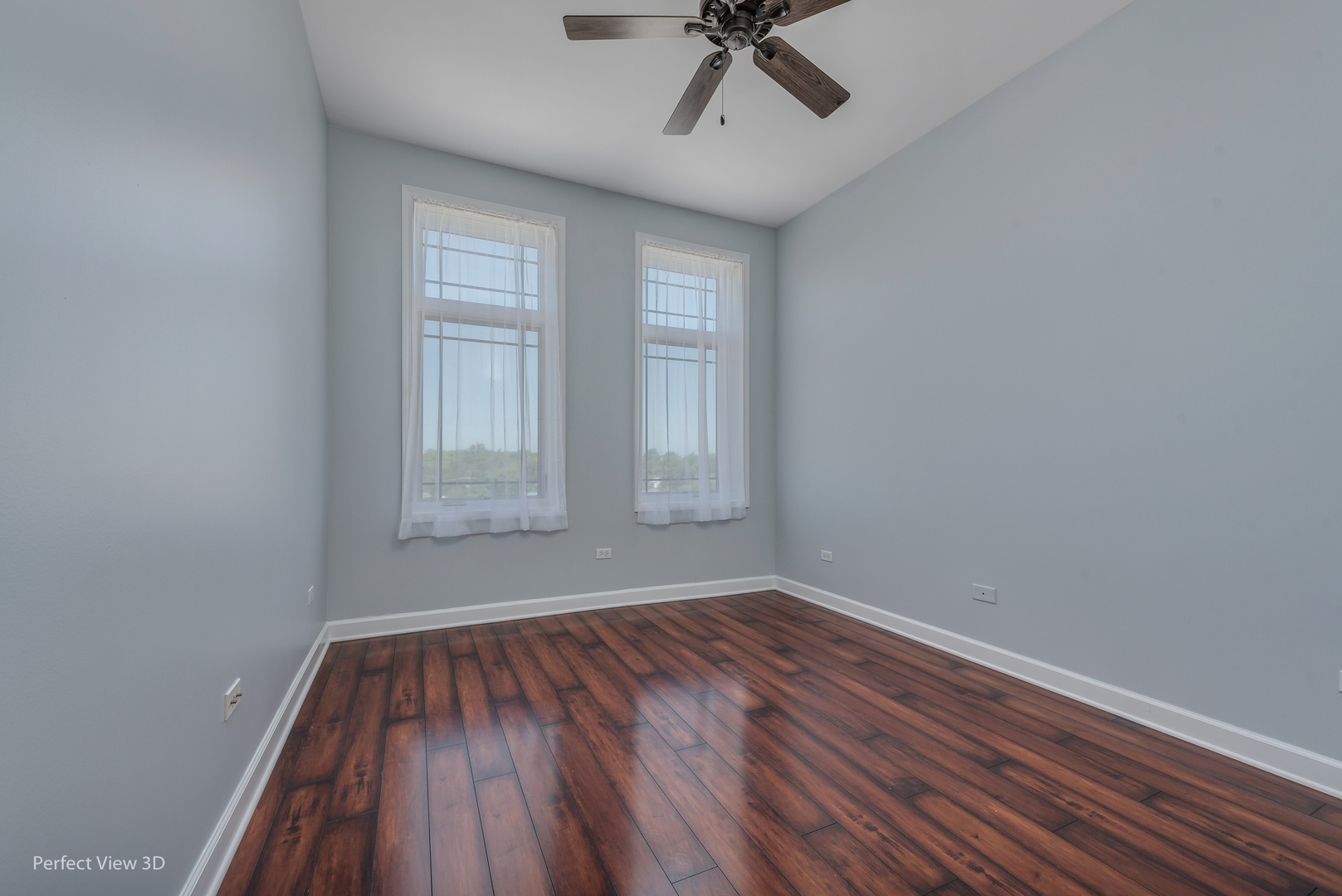 77 North Wolf Road, Unit 601 Northlake, IL 60164 - Photo 18 of 19 a view of empty room with wooden floor and fan