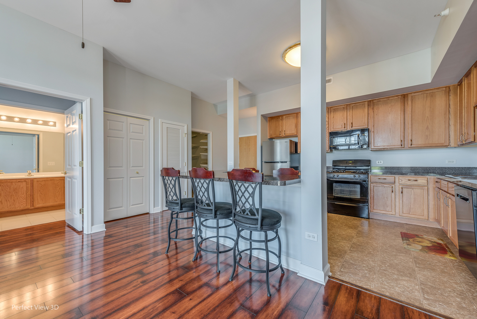 77 North Wolf Road, Unit 601 Northlake, IL 60164 - Photo 3 of 19 a view of a kitchen with furniture and wooden floor