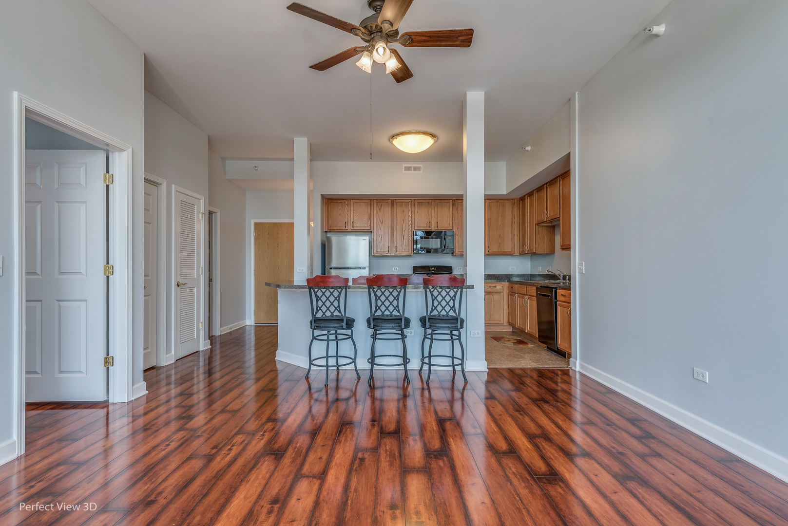 77 North Wolf Road, Unit 601 Northlake, IL 60164 - Photo 7 of 19 a view of a dining room with furniture wooden floor and a chandelier