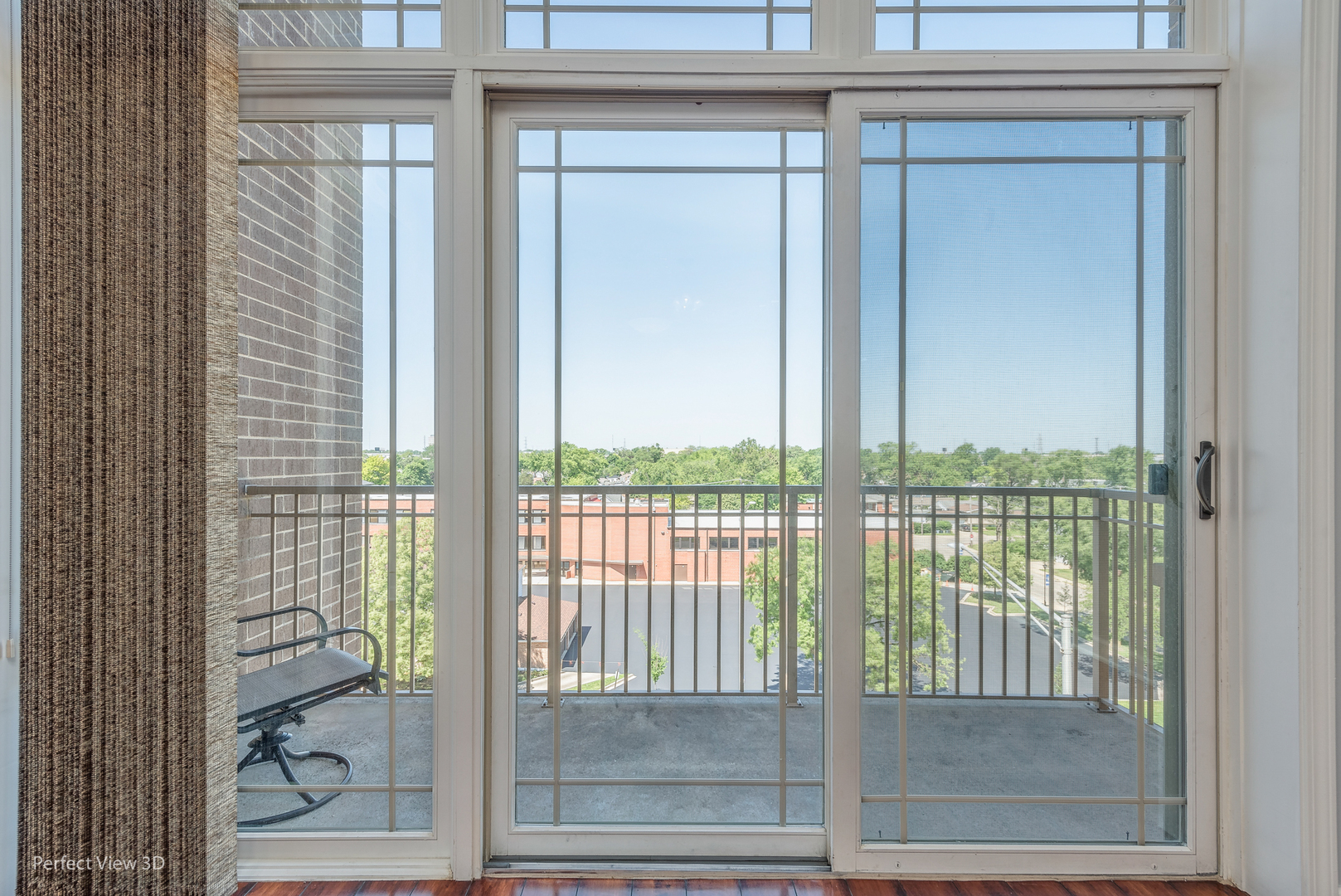 77 North Wolf Road, Unit 601 Northlake, IL 60164 - Photo 8 of 19 a view of a glass door with a balcony from a glass door