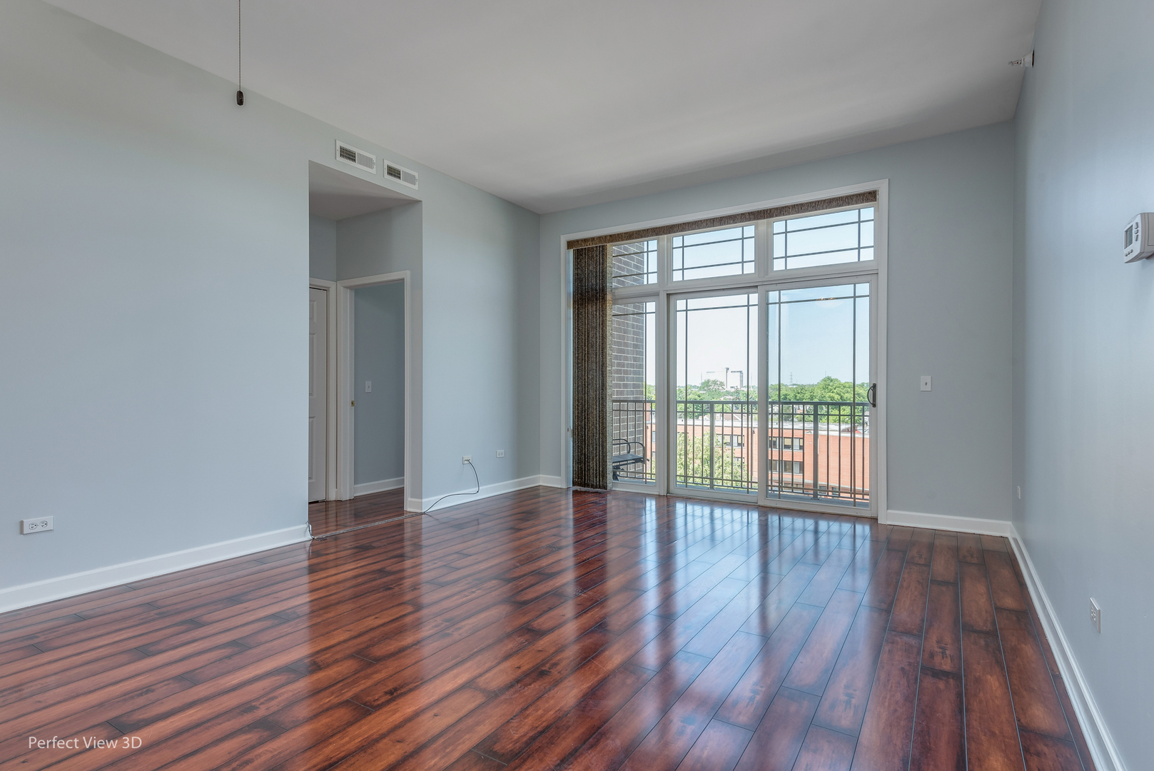 77 North Wolf Road, Unit 601 Northlake, IL 60164 - Photo 10 of 19 a view of an empty room with wooden floor and a window
