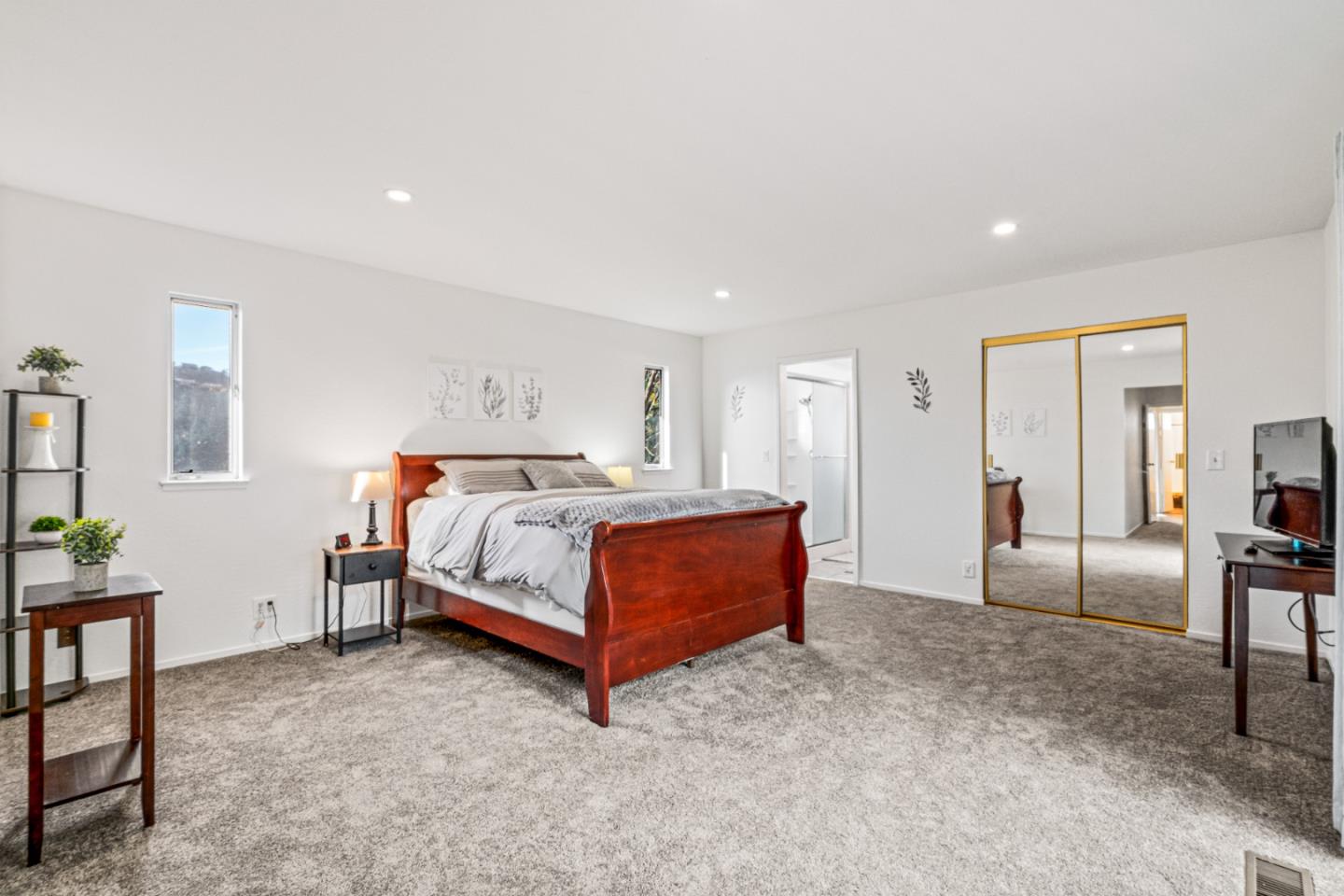 804 Prairie Creek Drive Pacifica, CA 94044 - Photo 20 of 64 a bedroom with a bed a table and painting