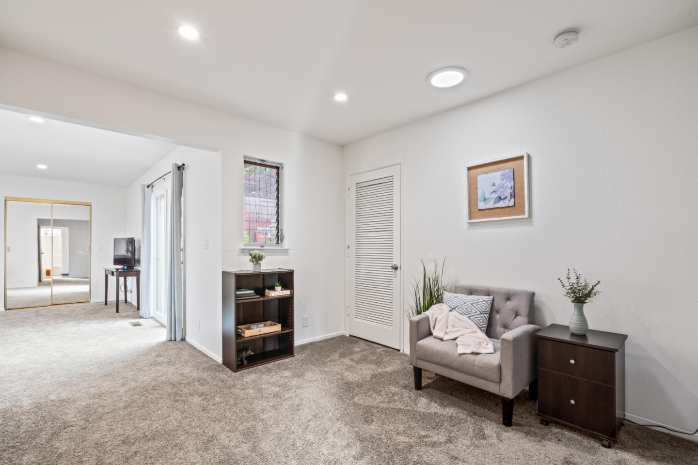 804 Prairie Creek Drive Pacifica, CA 94044 - Photo 23 of 64 a living room with furniture and a flat screen tv
