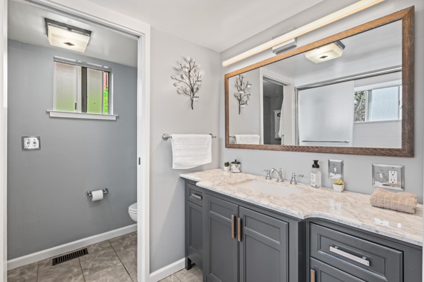 804 Prairie Creek Drive Pacifica, CA 94044 - Photo 26 of 64 a bathroom with a sink and a mirror