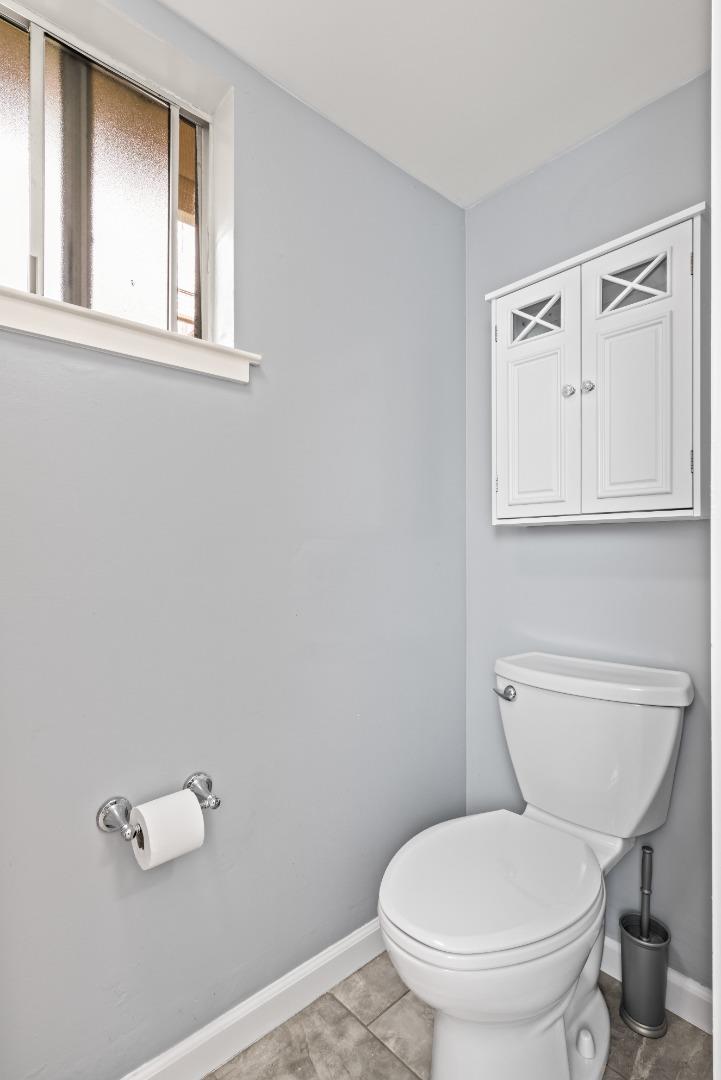 804 Prairie Creek Drive Pacifica, CA 94044 - Photo 29 of 64 a white toilet sitting next to a bathroom sink