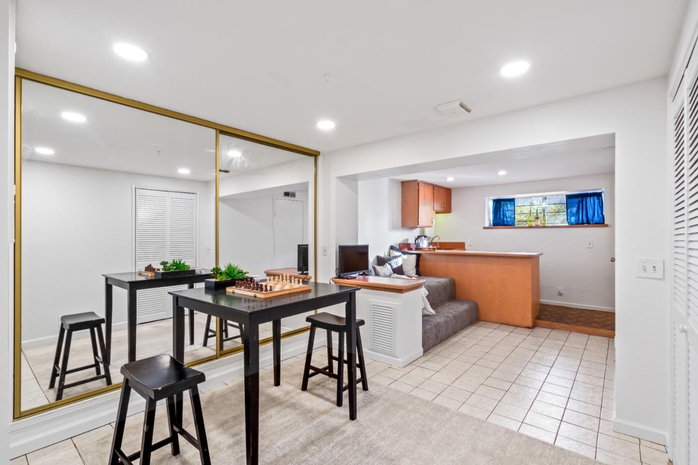 804 Prairie Creek Drive Pacifica, CA 94044 - Photo 34 of 64 a room with a table chairs and a kitchen view