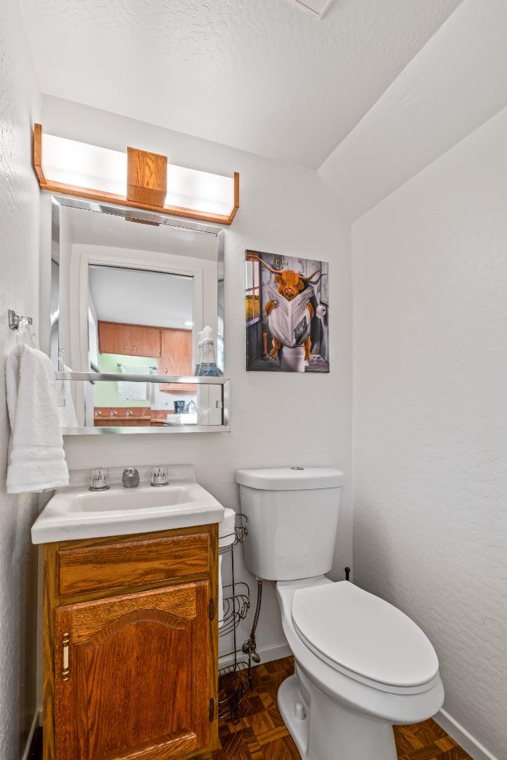 804 Prairie Creek Drive Pacifica, CA 94044 - Photo 37 of 64 a bathroom with a toilet a sink and a mirror