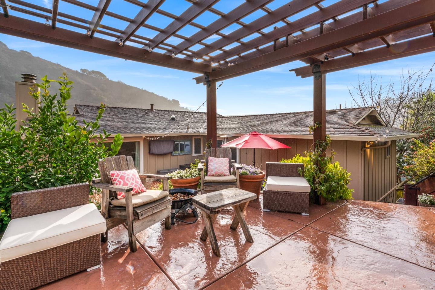 804 Prairie Creek Drive Pacifica, CA 94044 - Photo 46 of 64 a view of a patio with a dining table and chairs under an umbrella