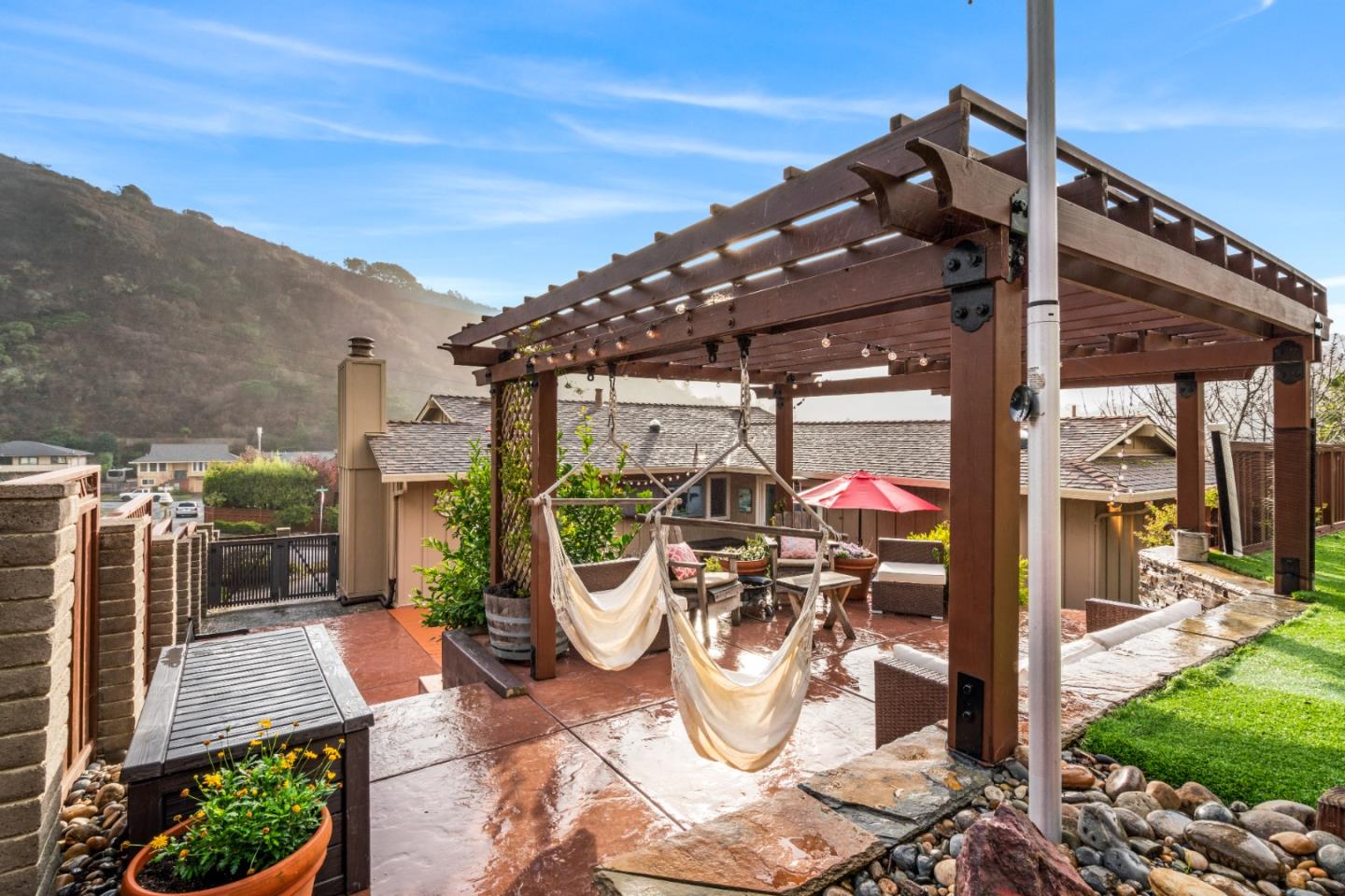 804 Prairie Creek Drive Pacifica, CA 94044 - Photo 48 of 64 a view of a patio with a dining table and chairs and a fire pit