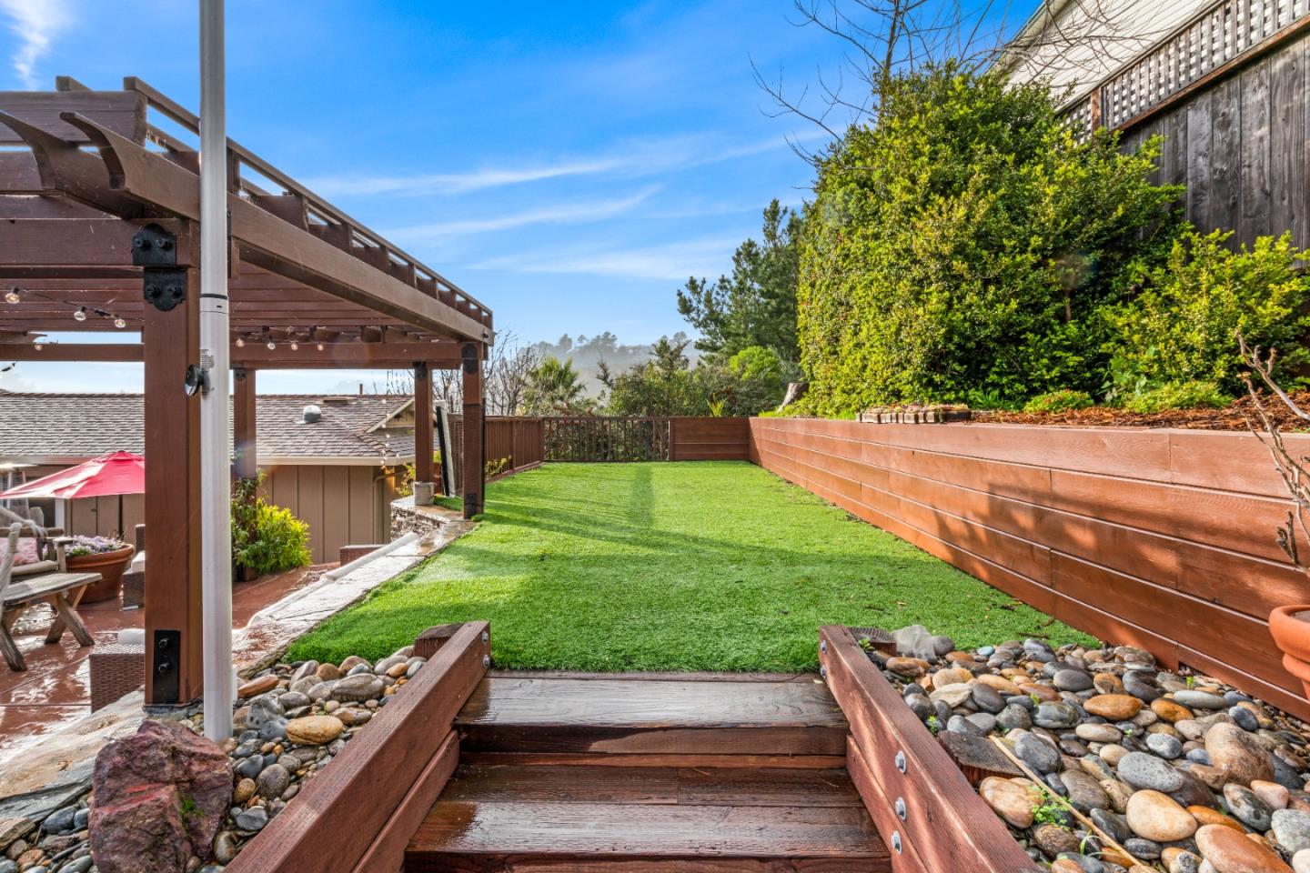 804 Prairie Creek Drive Pacifica, CA 94044 - Photo 50 of 64 a view of backyard with a garden and outdoor seating