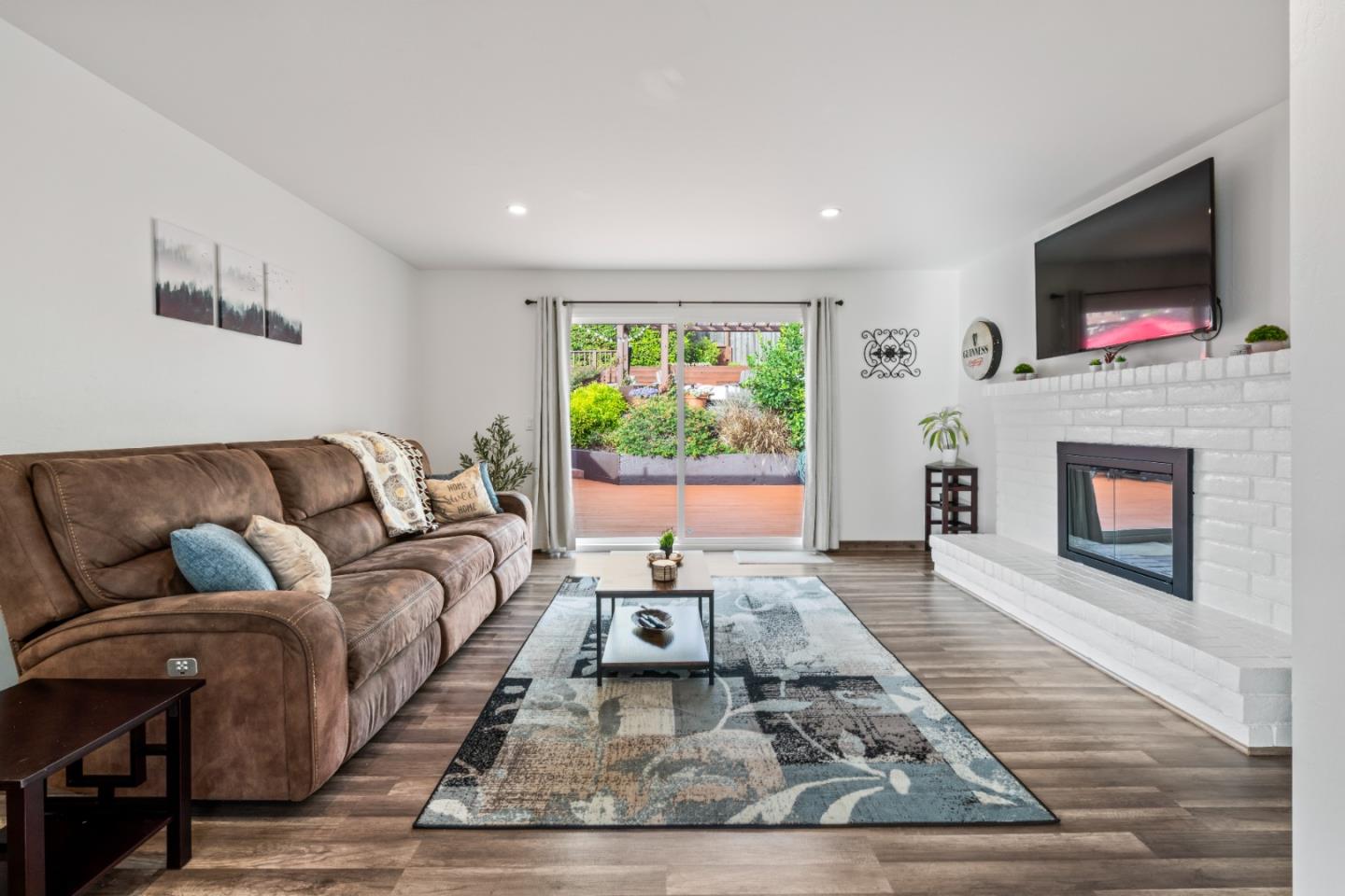 804 Prairie Creek Drive Pacifica, CA 94044 - Photo 7 of 64 a living room with furniture and a flat screen tv