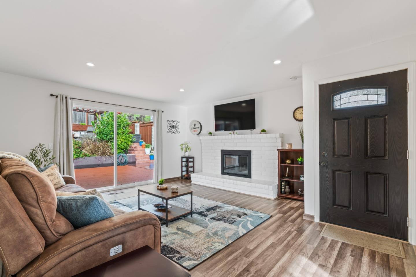 804 Prairie Creek Drive Pacifica, CA 94044 - Photo 8 of 64 a living room with furniture and a fireplace