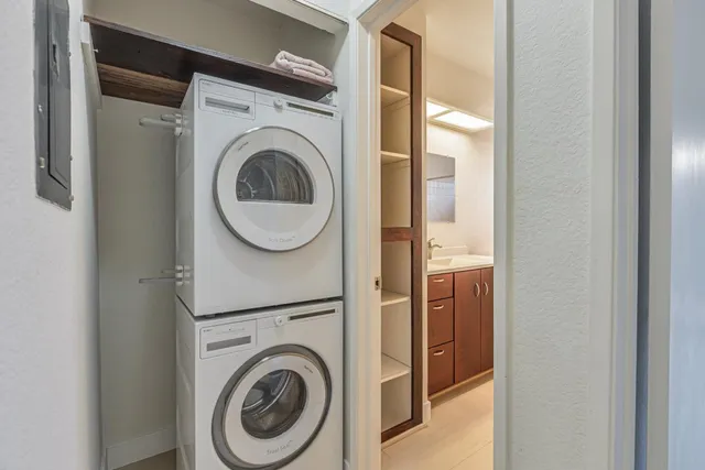 a stove top oven sitting inside of a kitchen