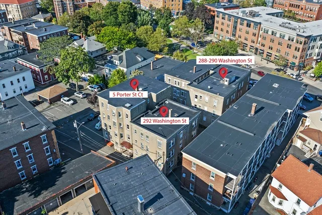 an aerial view of a building with an outdoor space