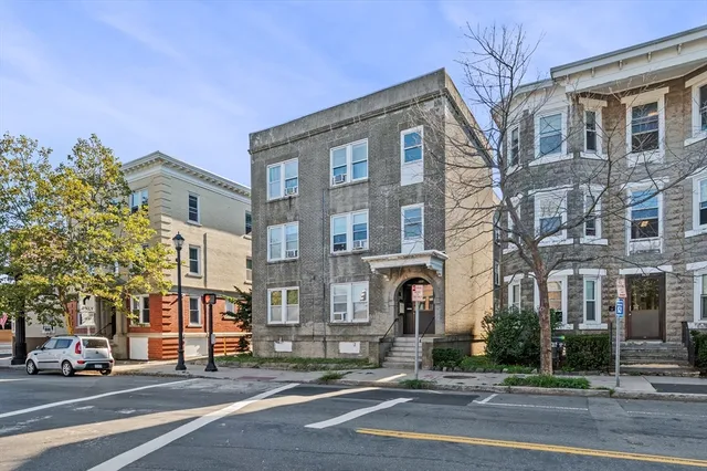 a front view of a building with street view