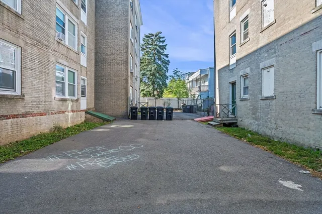 a view of a brick building with many windows